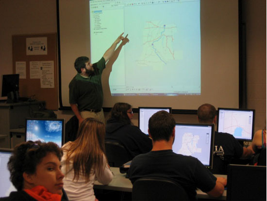 People looking at map in classroom