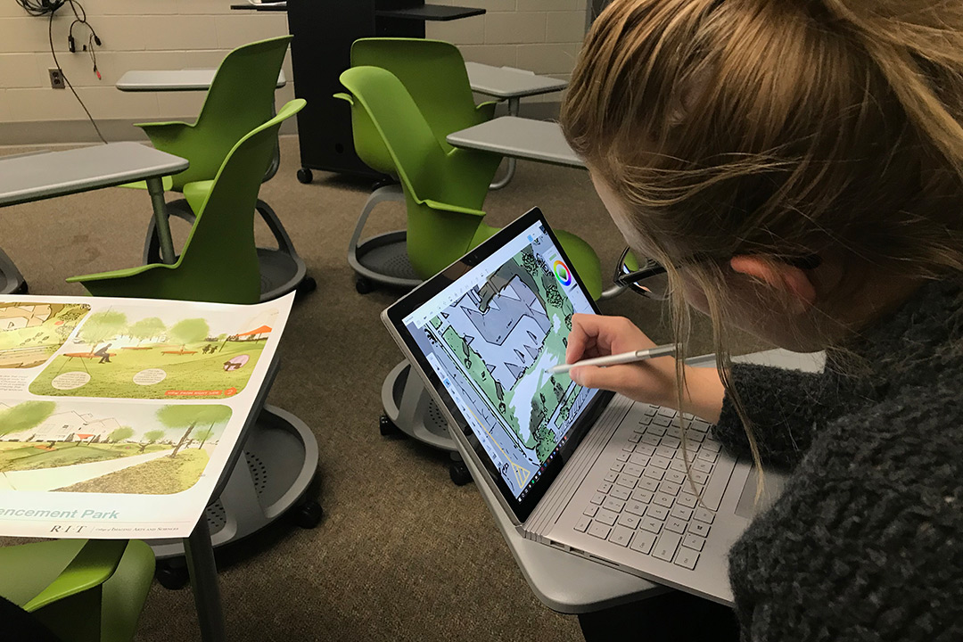 Stefani Schultz uses her laptop to digitally sketch out design ideas for the team's park.