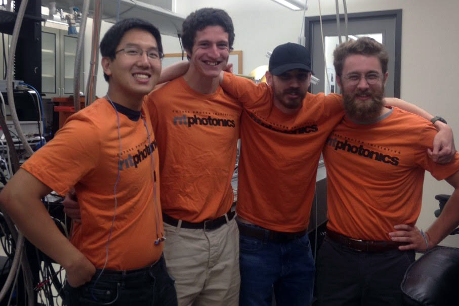 Austin Ford poses for a photo with three friends who also work at the Center for Detectors.