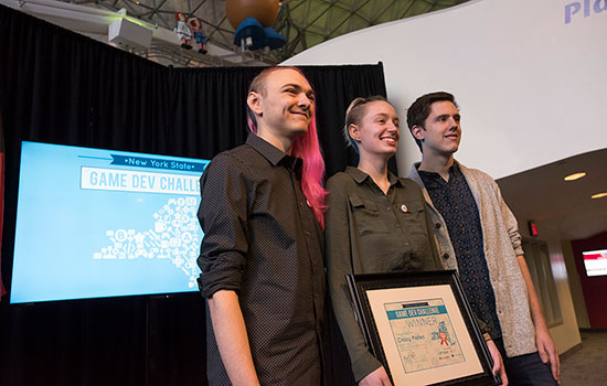 The RIT student team poses for a photo with their Game Dev Challenge first place certificate.