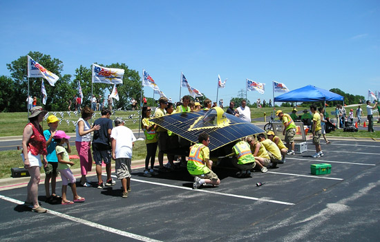 People working on car