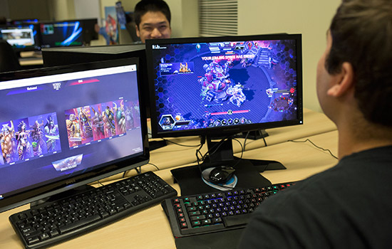 two students playing computer games.