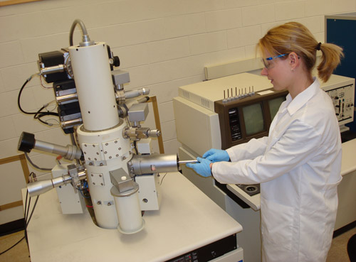 Researcher using machine