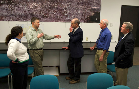 People talking with astronaut