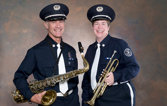 Two musicians posing for camera