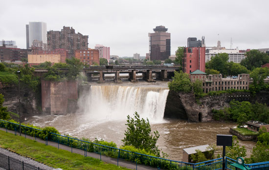 Picture of waterfall near city buildings