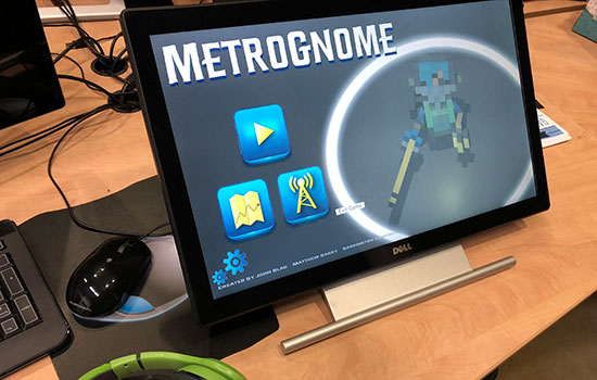 Tablet screen showing Metrognome logo and game start screen.
