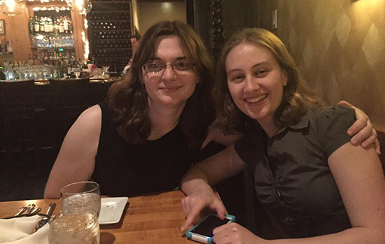 two students out to dinner at a restuarant.