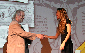 Two people shaking hands on stage