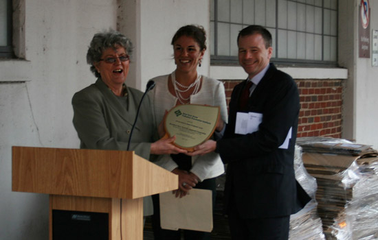 People posing with award 