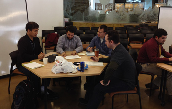 People working around table