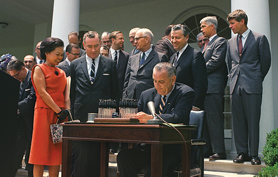 United States of America President signing paperwork outside
