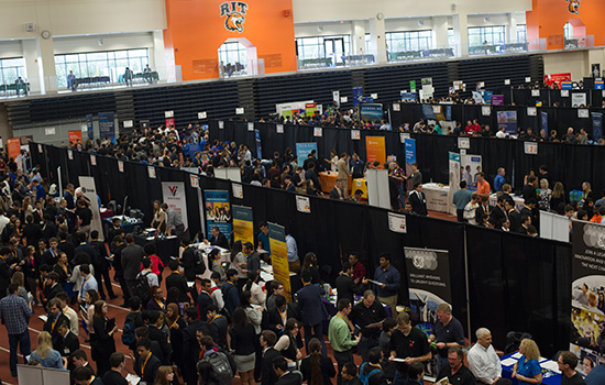 People walking around indoor event