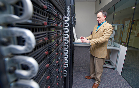 Professor working in Super computer room