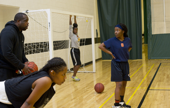 students playing basketball.