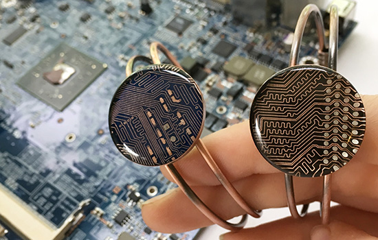 Person holding rings made of circuits