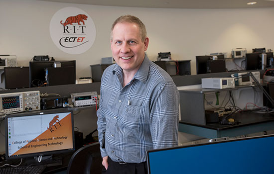 Steven Ciccarelli poses for a photo in one of the computer labs on campus.