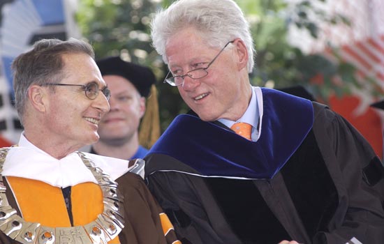 Bill Clinton talking to RIT President at graduation