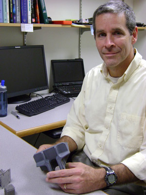 Professor posing in office