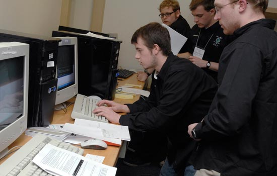 Students gathered around a computer