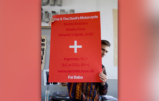 Person holding poster for "Boys & Devil's Motorcycle Serata Svizzera Studio Force"