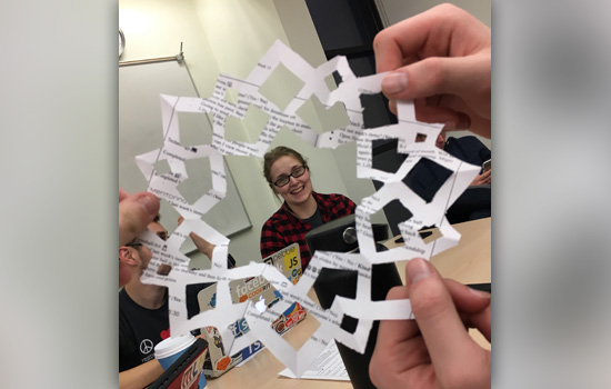 Picture of person framed by paper snowflake