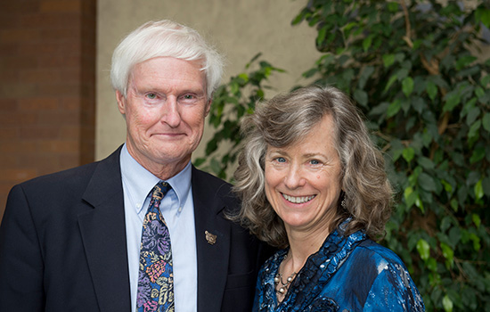 Two people posing for camera