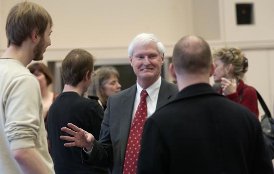 Dean and Faculty talking at an event