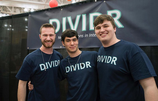 three people wearing T shirts that say D I V I D R.