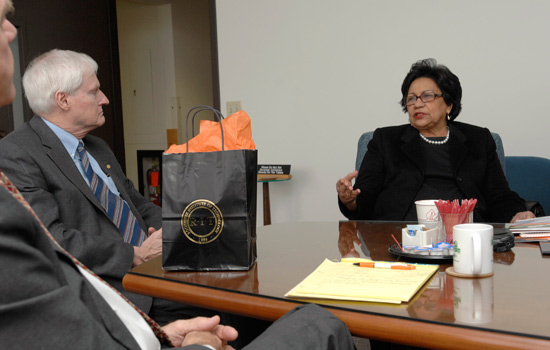 RIT President and government official talking together