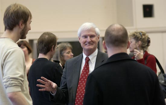 Dean and Faculty talking at an event