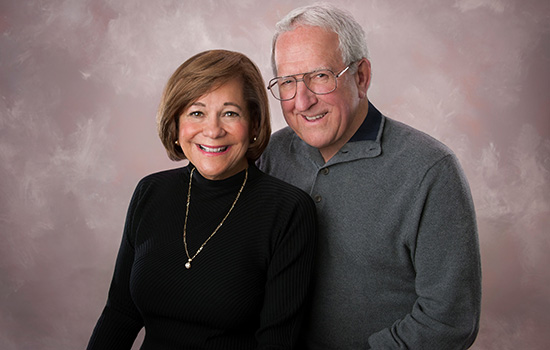 Two people posing for camera