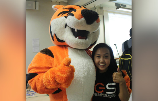 Person posing with mascot