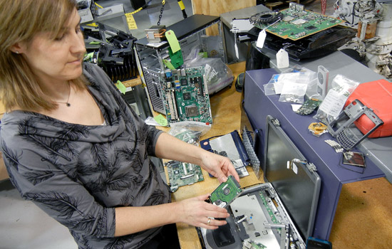 People working on computer parts
