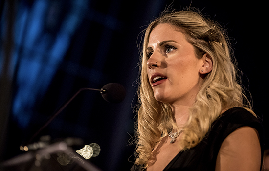 person speaking at a podium.