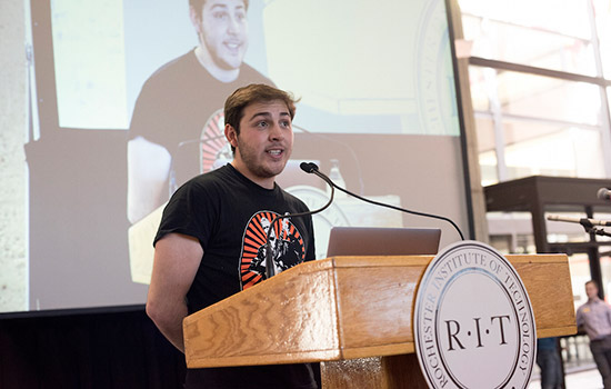 Student speaking at podium 