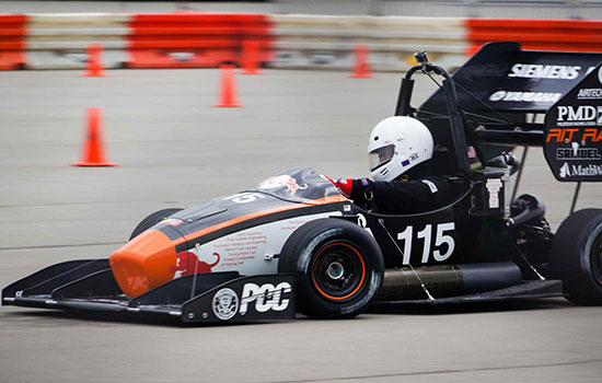 Person racing formula car