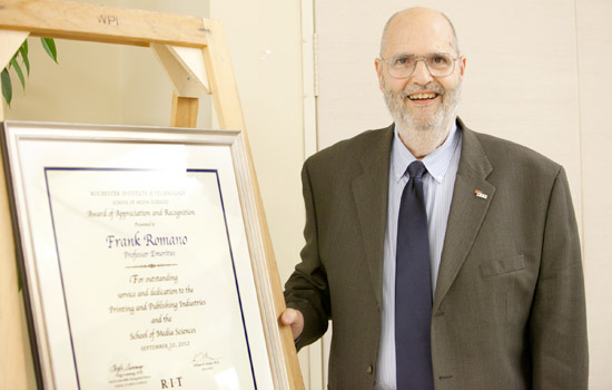 Person posing with award