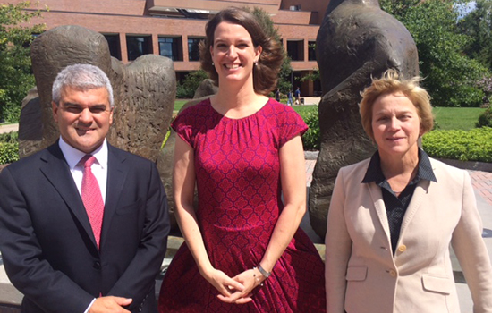 Dean Winebrake, Becky Wehle, and Anne Haake pose for a photo in front of an outdoor sculpture behind the College of Liberal Arts.