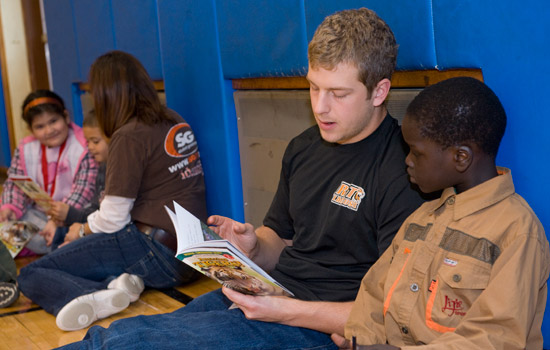 People reading books to kids