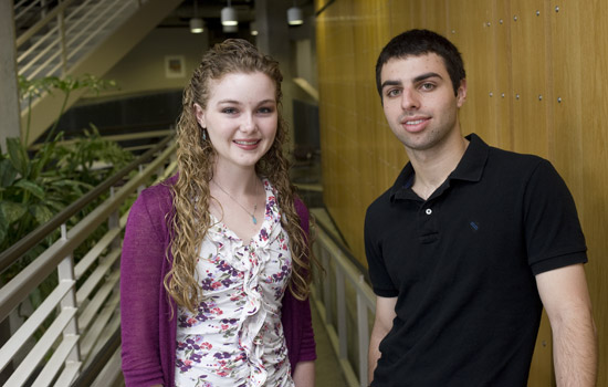 Two people posing for camera