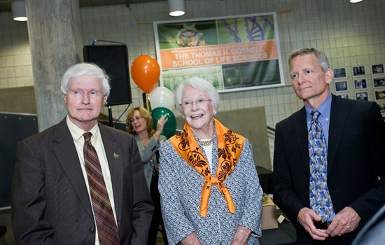 Three people posing for camera