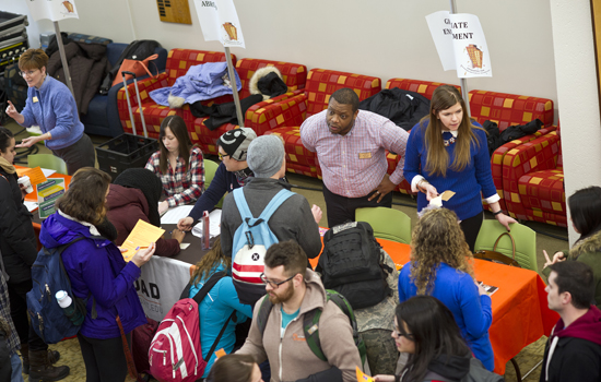 People speaking at tables