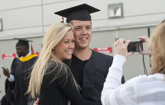People posing for camera at graduation