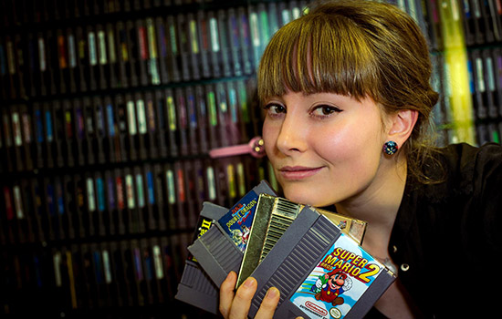 Person posing with games