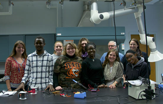 People posing in classroom