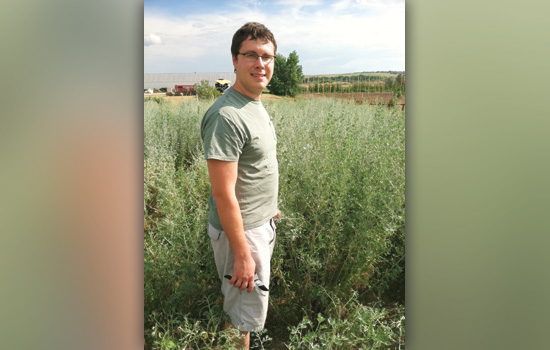 Person posing for camera in field