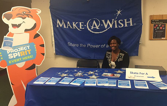 Person posing at table for "Make a Wish"