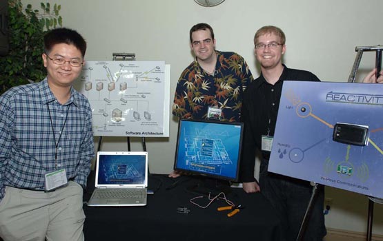 Students standing in front of diagrams
