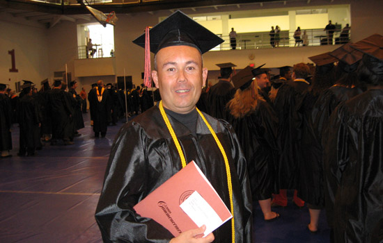 Graduate holding diploma 